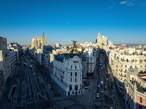 Madrid, Spain - 17 January 2025: Aerial view of the beautiful Edificio Metropolis amidst a vibrant cityscape at sunset, Centro, Madrid, Spain.