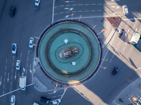 Aerial view of busy Plaza Cibeles with vibrant traffic and beautiful architecture, Centro, Madrid, Spain.