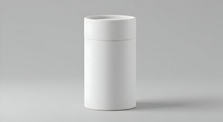 White Cylindrical Container Against Gray Background