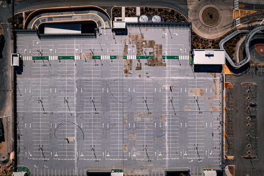 Aerial view of empty carpark with geometric patterns and modern infrastructure, Perth, Western Australia, Australia.