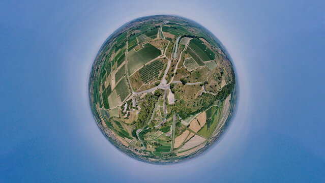 Aerial view of tiny planet landscape with beautiful fields and vineyards, Colombiers, Herault, France.
