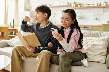 Fototapeta premium Young couple enjoying a cozy afternoon together at home with coffee and a book