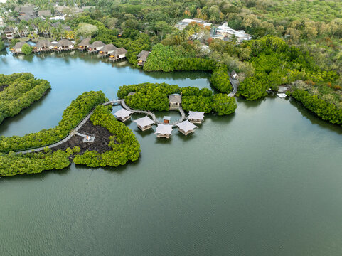 Aerial view of luxurious resort surrounded by serene lagoon and tropical greenery, prince maurice, flacq, mauritius.