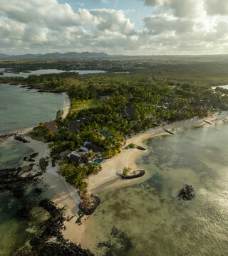 Aerial view of beautiful tropical beach and serene lagoon with luxury resort, Prince Maurice, Flacq, Mauritius.
