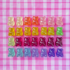 Colorful Gummy Bear Candy on Pink Gingham Background