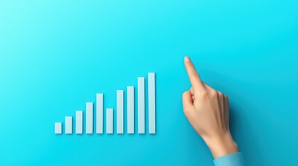 A hand points at a rising bar graph on a vibrant blue background, symbolizing growth and progress in business or analytics.