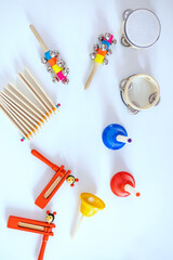Children's musical instruments. Wooden toys. Funny child motif. For improving creativity and talent. Developing wooden musical toys for children. Top view. Flat lay. White background