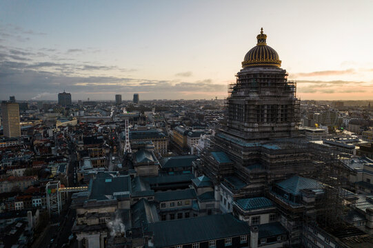 Aerial view of the Palace of Justice and cityscape at sunrise with a Ferris wheel, Sablon, Brussels-Capital, Belgium.