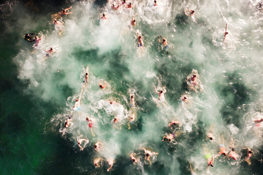 Aerial view of people swimming in cold water during the Epiphany Christian holiday, Varna, Varna, Bulgaria.