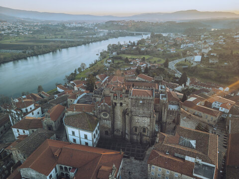 Aerial view of catedral de santa maria de tui and minho river with beautiful old town rooftops, tui, pontevedra, spain.