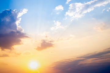 Sky,sunset, beautiful , luxury soft gradient orange gold clouds and sunlight on the blue sky perfect for the background, Sunrise on morning or evening in winter warm time ,Twilight summer,silhouette