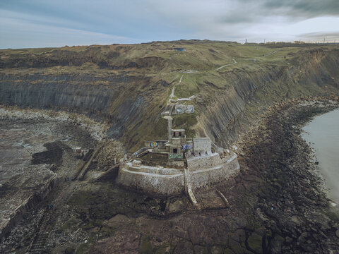 Aerial view of blockhaus stutzpunkt 221 arnika on a rocky cliff overlooking the sea, Pointe de la Creche, Pas-de-Calais, France.