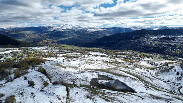 Aerial view of breathtaking snow-covered mountains and serene forested valleys, Posof, Ardahan, Turkiye.