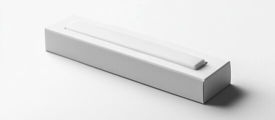 A white rectangular package with a raised rectangular compartment