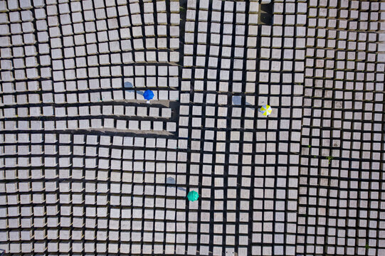 Aerial view of abstract urban grid with modern blocks and tiles, Sabrang Union, Teknaf, Chattogram, Bangladesh.