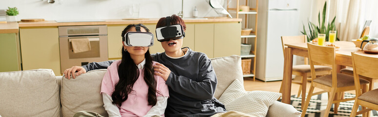 Enjoying a cozy day at home with virtual reality as a young couple connects