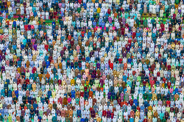 Shibganj, Bangladesh - 10 July 2022: Aerial view of a vibrant and colorful eid prayer gathering with a large crowd of people, Mokamtala, Shibganj, Rajshahi, Bangladesh.