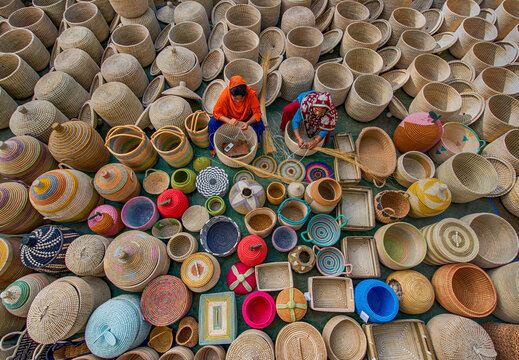 Bogura, Bangladesh - 29 October 2020: Aerial view of vibrant handicrafts being made with colorful woven baskets and artisans at work, Sherpur, Bogura, Rajshahi, Bangladesh.