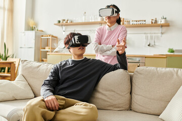 Young couple enjoying virtual reality adventures in their cozy home environment