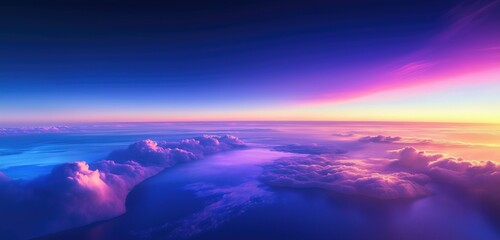 A breathtaking view of the open sea at dawn, where distant clouds take on hues of purple and blue as the sun rises. 
