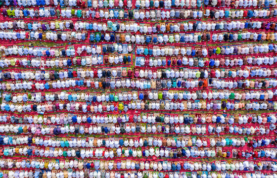 Aerial view of a colorful gathering of people in prayer during Eid, Nishindara, Bogura, Rajshahi, Bangladesh.