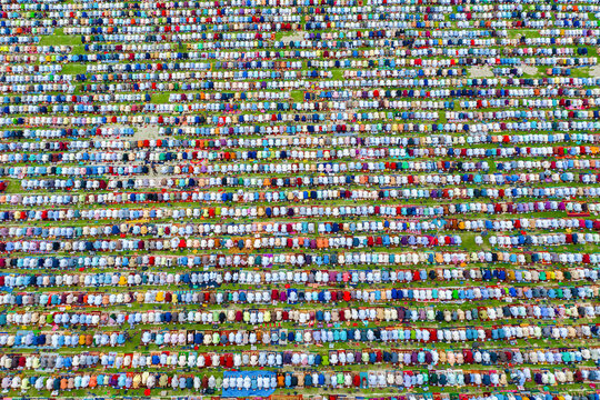 Aerial view of a colorful crowd gathered for Eid Prayer at a mosque, Dinajpur, Rangpur, Bangladesh.