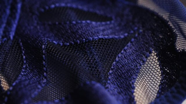 Close-up of blue beautiful lace texture fabric. Close up of an elegant blue lace dress. High quality 4k footage