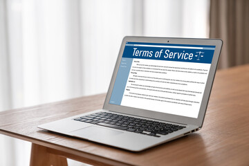 Fototapeta premium Online term of service conditions showing brisk rules and regulations in using the website on device screen for users to make an agreement to the online term of service