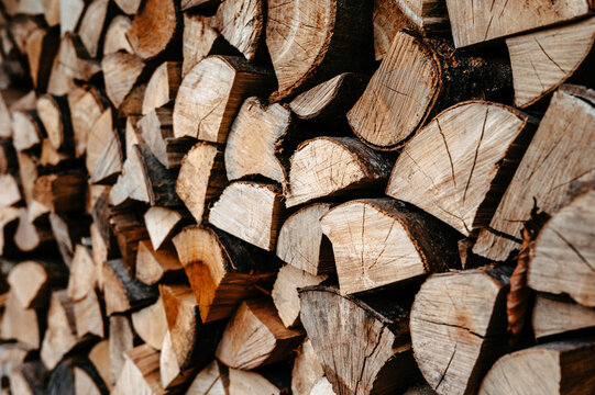 Stack of Chopped Firewood Logs with Natural Wood Grain Pattern