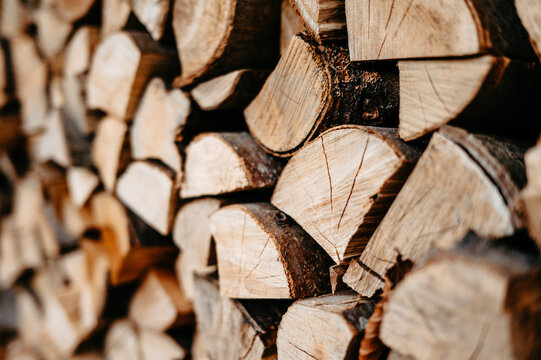 Stack of Chopped Firewood Logs with Natural Wood Grain Pattern