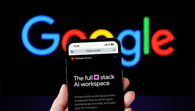 Ho Chi Minh City, Viet Nam - April 10th, 2025 Smart phone with Firebase Studio, Google on dark background. Generative ai, artificial intelligence