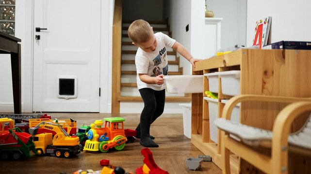 A Playful Child Enjoying a Variety of Colorful Toys This image depicts a playful child fully engaged and having fun with vibrant toys that ignite creativity and imagination during playtime