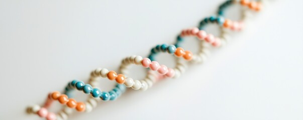 A colorful representation of a DNA double helix model showcasing connected beads in various hues.