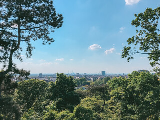 Beautiful view of a city with a blue sky and trees in the background