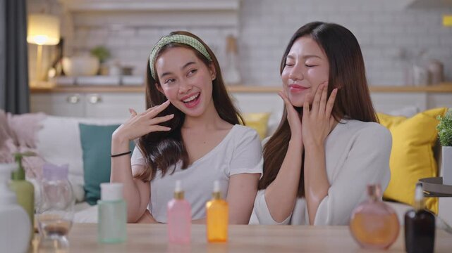 Two young Asian beauty influencer live-streams and reviews cosmetics for her online audience.