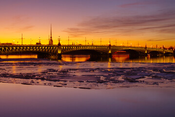 A sunset view of the Troitsky (Trinity) Bridge spanning the Neva River in St. Petersburg, Russia, captured in early spring