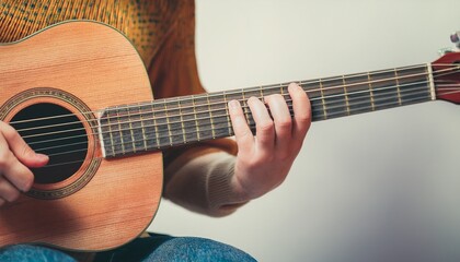 Fototapeta premium Fingers playing a guitar strings