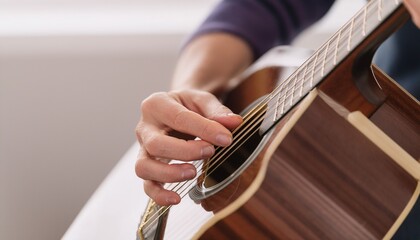 Fototapeta premium Fingers playing a guitar strings