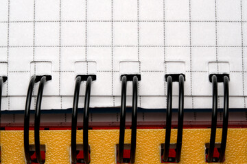 Spiral notebook in use, close-up shot
