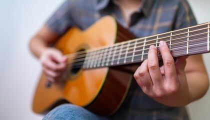 Fototapeta premium Fingers playing a guitar strings
