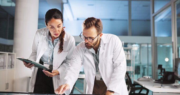 Scientist, people and meeting with tablet for review, medical research or innovation. Technology, interactive display and clinical biotech partnership for science, teamwork study or results.