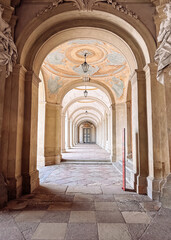 Long, narrow hallway with a red object in the middle