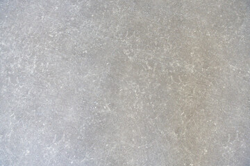 Zoom sur un carrelage gris.