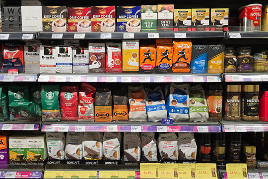Bangsar, Malaysia - Mar 29, 2025: Assortment of premium ground, instant, and drip coffee brands including Starbucks, Nescaf&eacute;, Boncaf&eacute;, Davidoff, and Robert Timms displayed in a grocery aisle.