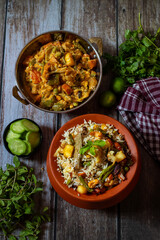 Navratan Pulao is a rich, aromatic Indian rice dish made with basmati rice, mixed vegetables, nuts, and dried fruits, offering a delightful sweet-savory flavor.