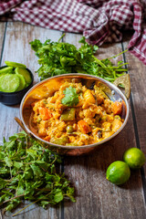 Navratan Korma is a rich, creamy Indian curry made with vegetables, nuts, and fruits, flavored with aromatic spices.