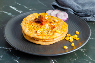 Corn cheese paratha is a delicious Indian flatbread stuffed with spiced sweet corn and melted cheese, perfect for breakfast or snacks.