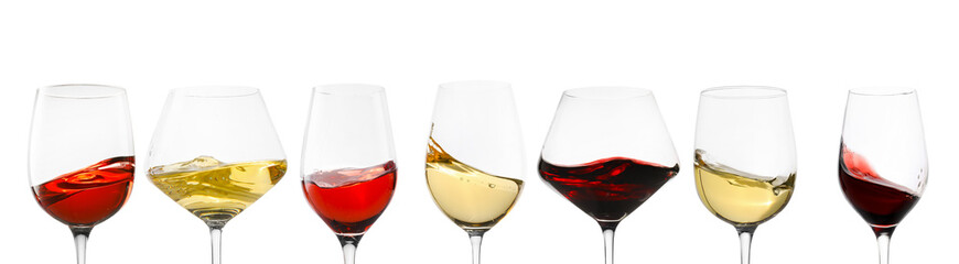 Different types of wine splashing in glasses on white background, set