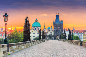 Prague, Czech Republic. Charles Bridge (Karluv Most) and Old Town Tower at sunrise.