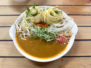 A bowl of Laksa Johor, a traditional dish from Johor, Malaysia.  Top view.